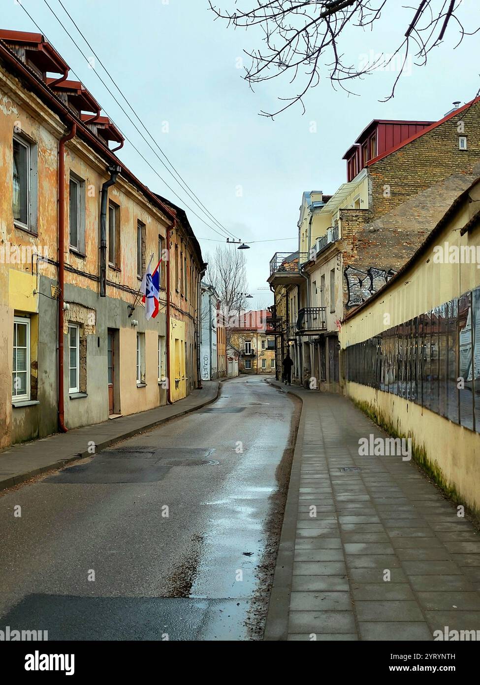 street in the micronation uzupis in lithuania with the constitution written on the wall - Smartphone Captured Stock Image