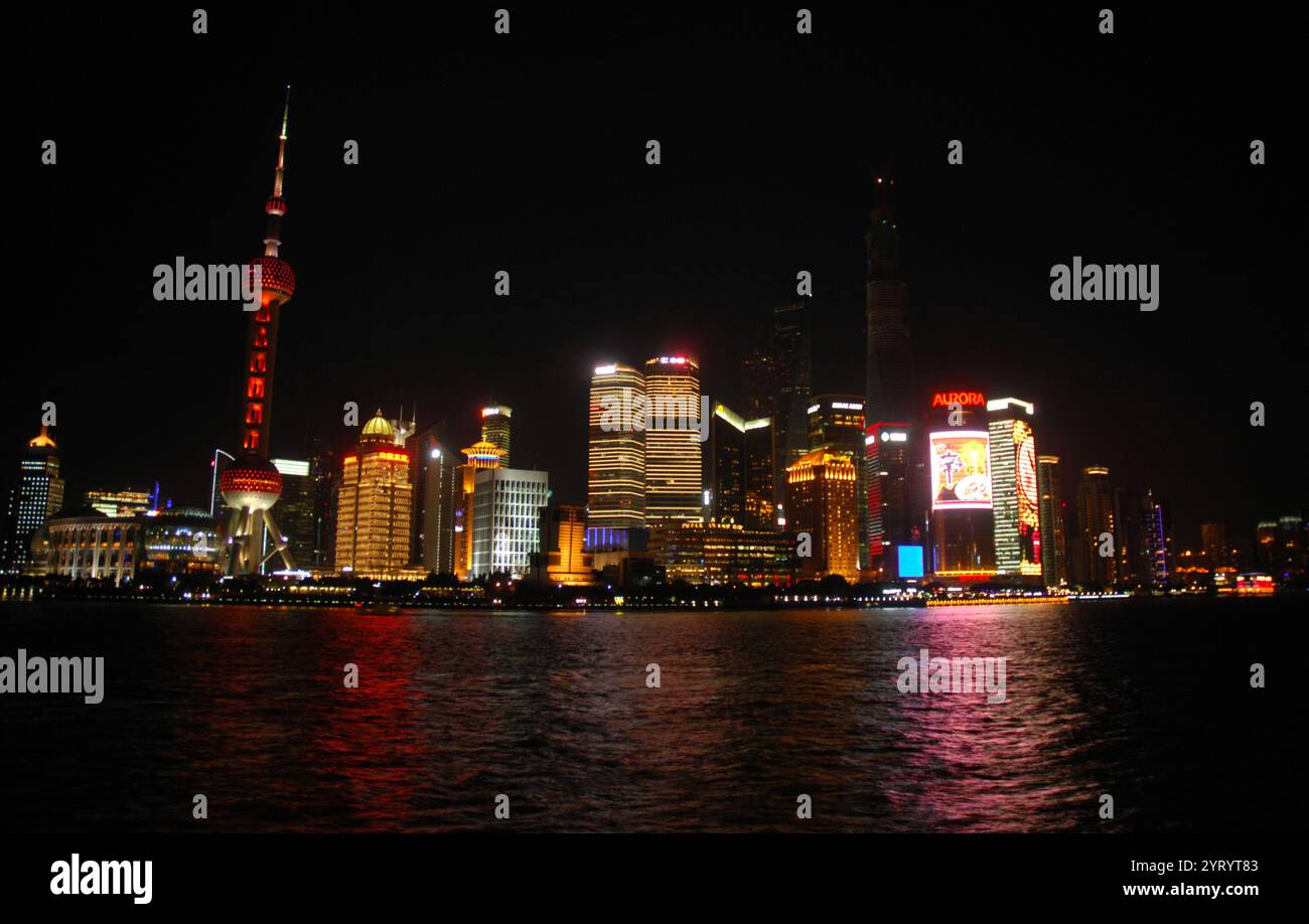 Shanghai in the People's Republic of China. It is located on the southern estuary of the Yangtze, with the Huangpu River flowing through it. With a population of 24.28 million as of 2019, it is the most populous urban area in China and the second most populous city proper in the world. Shanghai is a global centre for finance, innovation and transportation and the Port of Shanghai is the world's busiest container port. 2014 Stock Photo