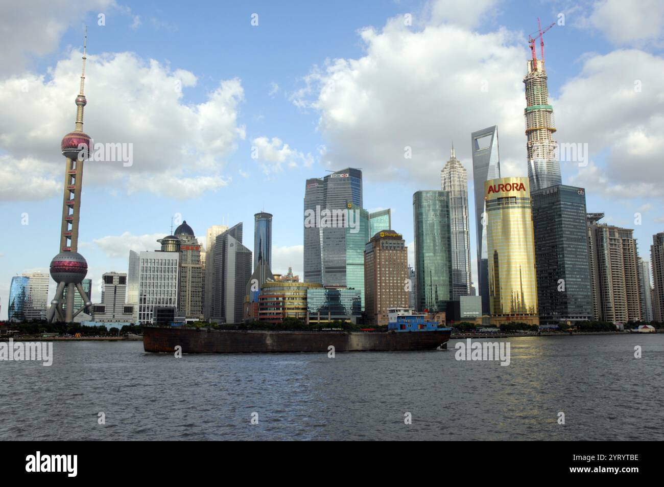 Shanghai in the People's Republic of China. It is located on the southern estuary of the Yangtze, with the Huangpu River flowing through it. With a population of 24.28 million as of 2019, it is the most populous urban area in China and the second most populous city proper in the world. Shanghai is a global centre for finance, innovation and transportation and the Port of Shanghai is the world's busiest container port. 2014 Stock Photo