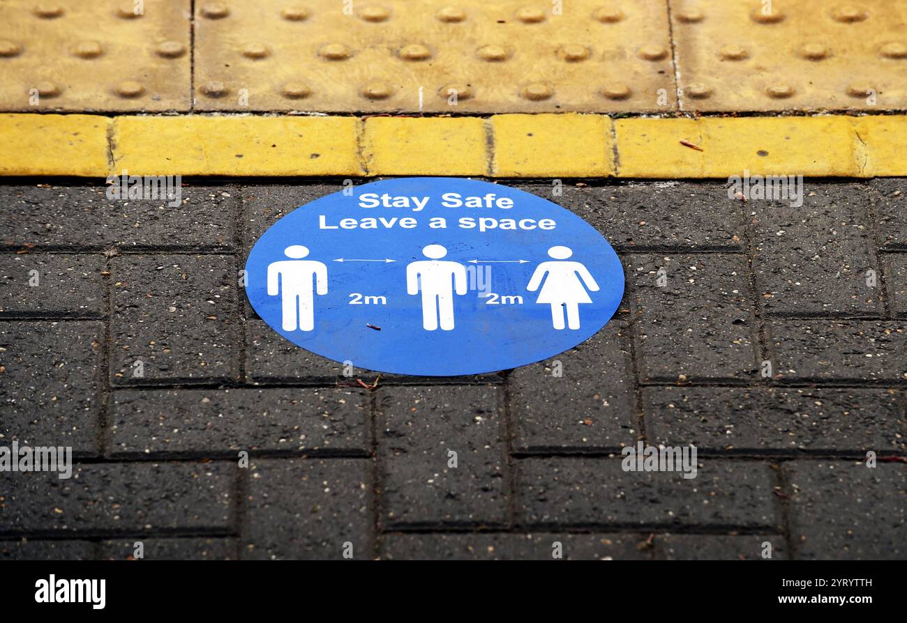 social distancing sign on a train platform in London, during the Corona virus outbreak. 28th April 2020 Stock Photo