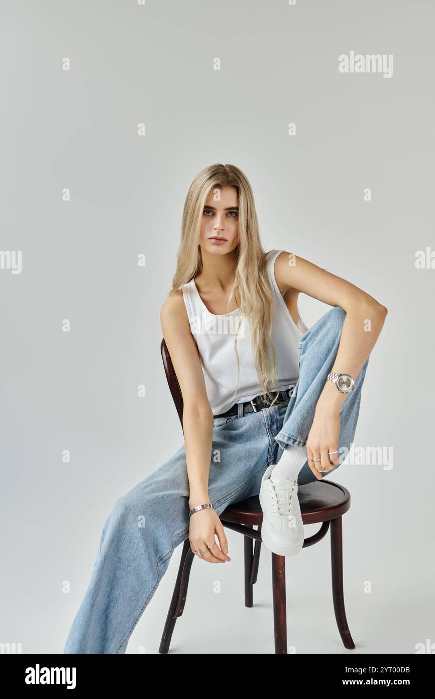 Stunning young woman with long blonde hair poses confidently in a ...