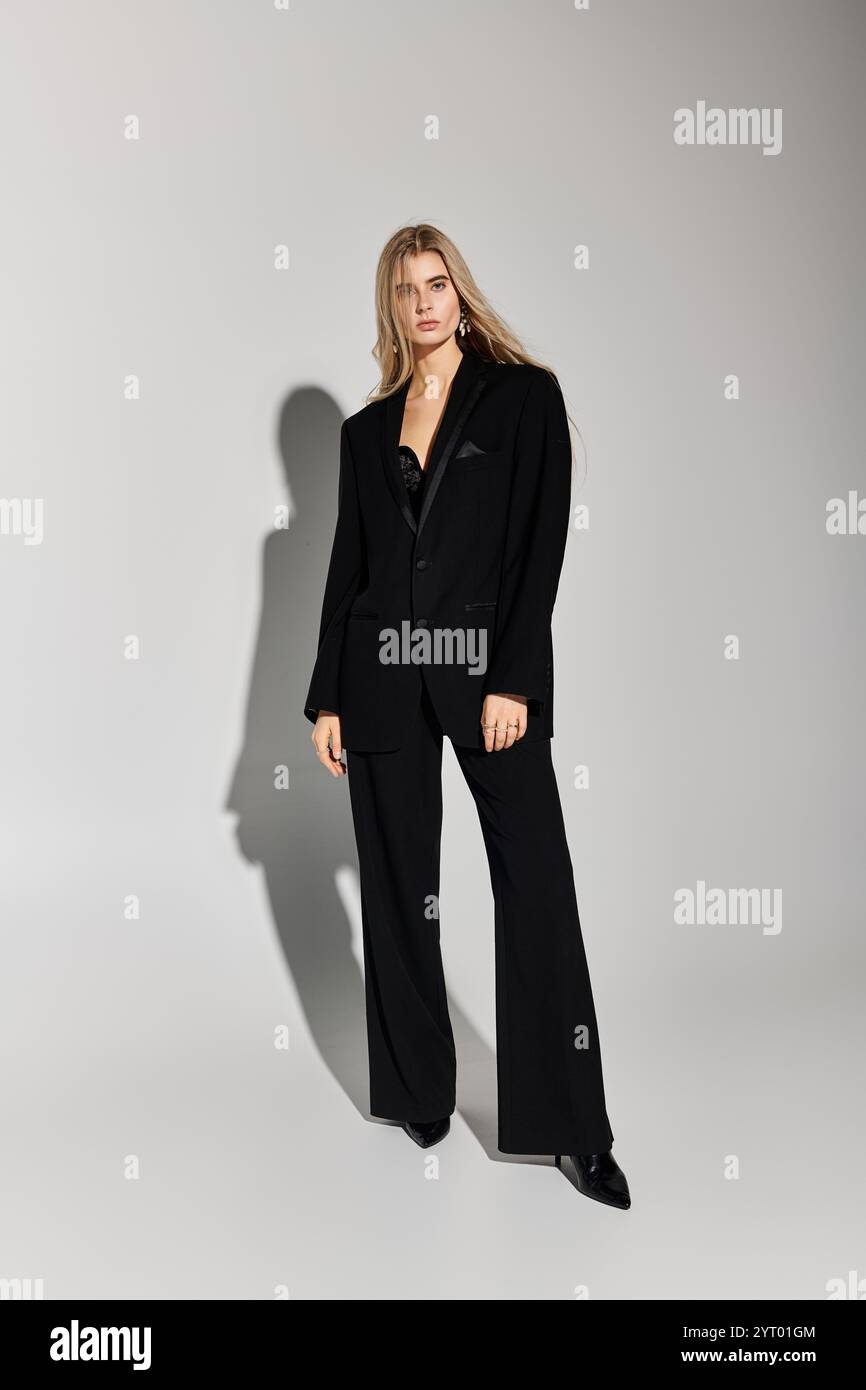 A stunning model with long blonde hair poses confidently in stylish ...