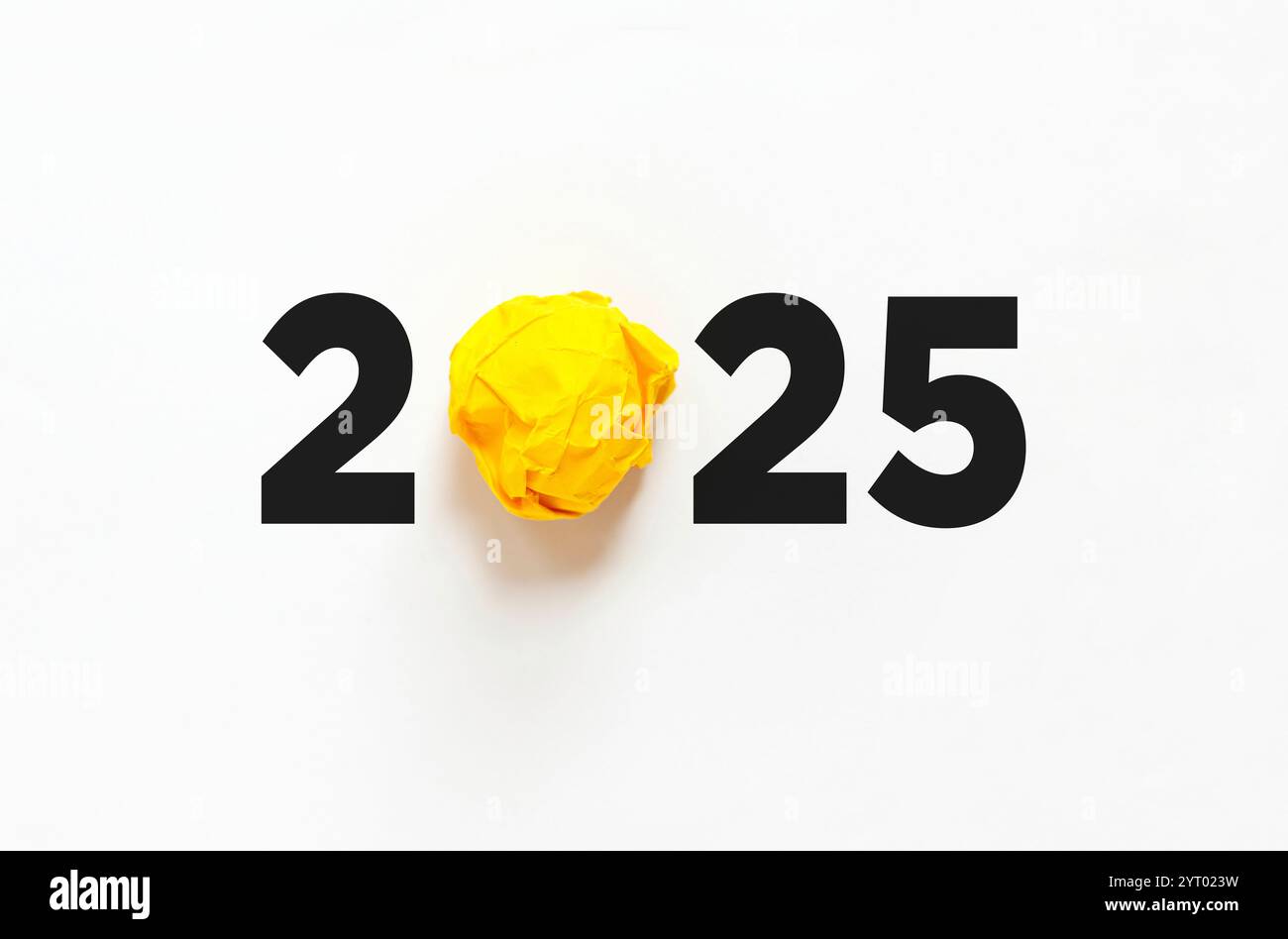 2025 year and crumpled yellow paper on white paper background texture, creative idea. Happy creative new year 2025, concept Stock Photo