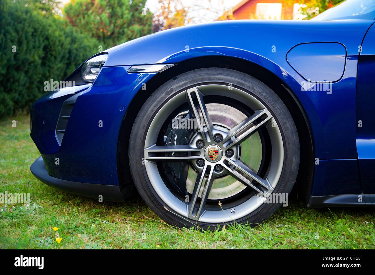 Vilnius, Lithuania - August 18, 2024 - Wheel of Porsche Taycan with logo Stock Photo