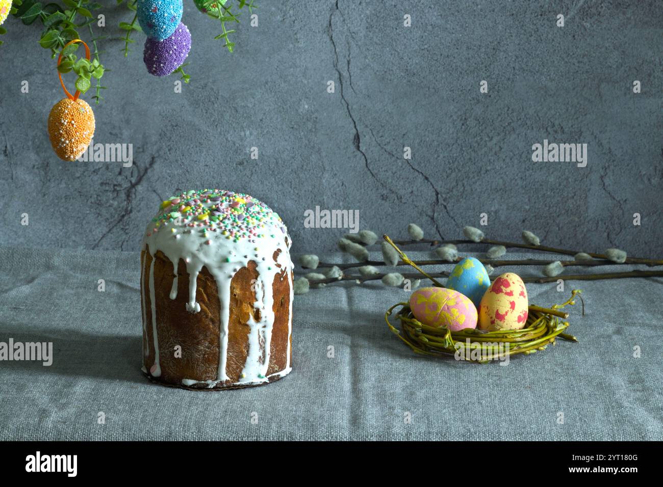 easter cake with painted eggs, sugar icing and willow branches Stock Photo
