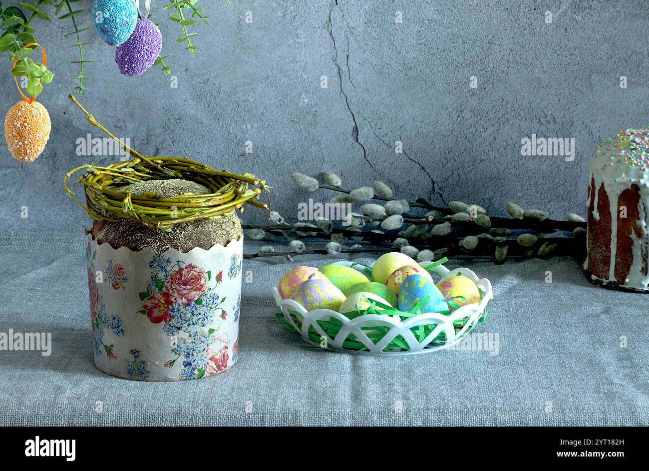 easter cake with painted eggs, sugar icing and willow branches Stock Photo