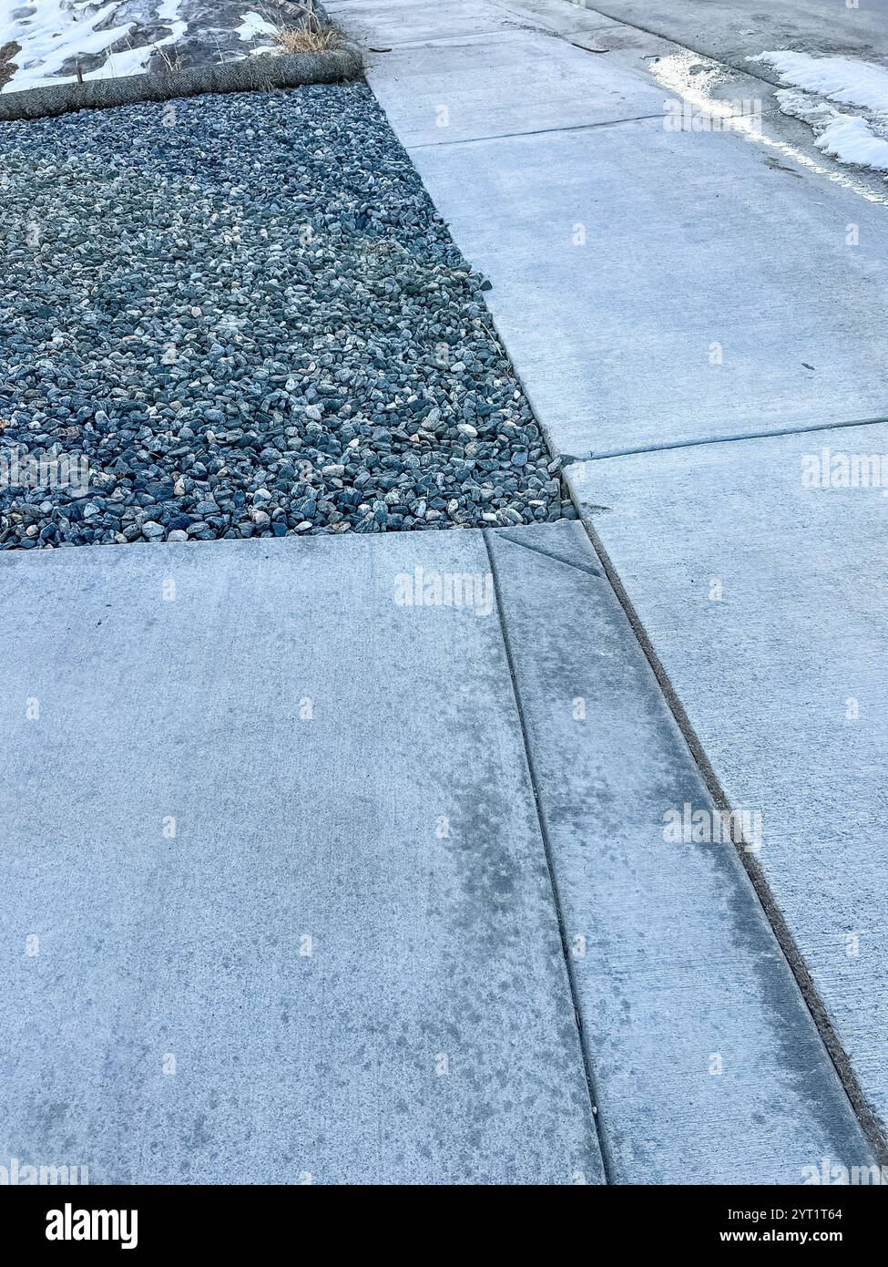 Concrete Sidewalk and Decorative Rock Border Stock Photo - Alamy
