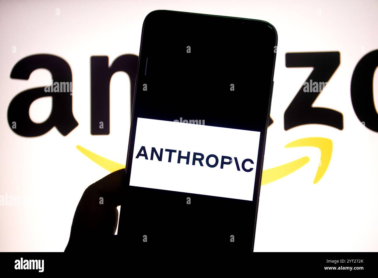 In this photo illustration, an Anthropic AI logo is seen displayed on a smartphone with an Amazon logo in the background. Stock Photo