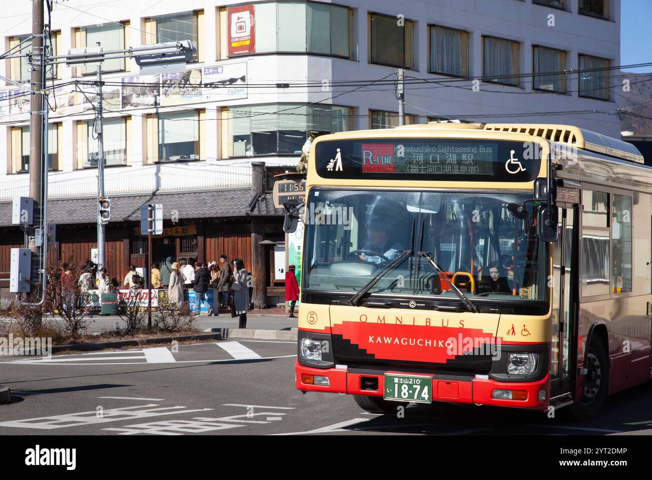 An omnibusbus with Fujisan Plaza located behind it at Kawaguchiko Station in Yamanashi Prefecture, Japan. Stock Photo