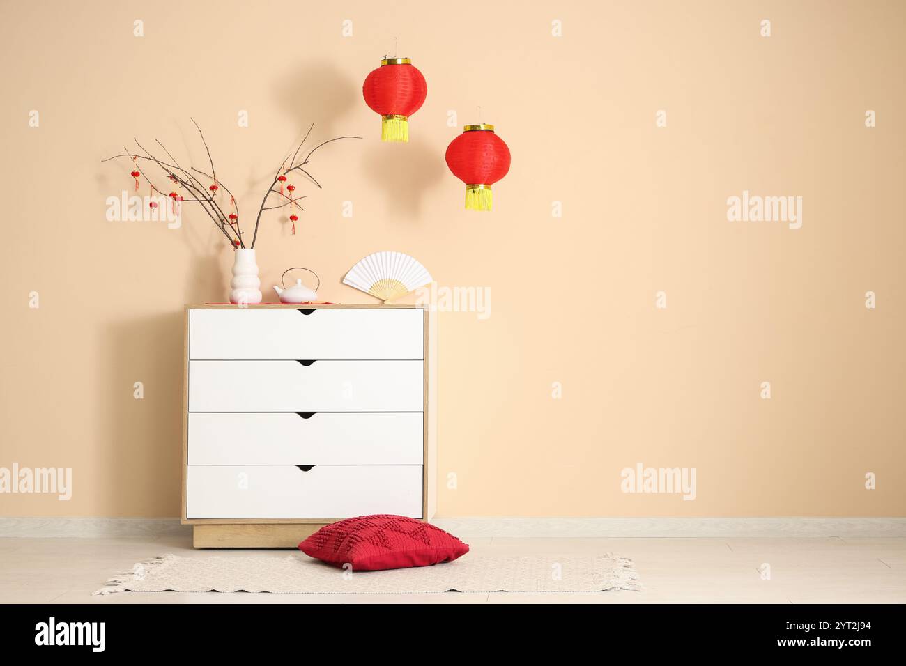 Interior of room decorated for Chinese New Year with commode and lanterns Stock Photo