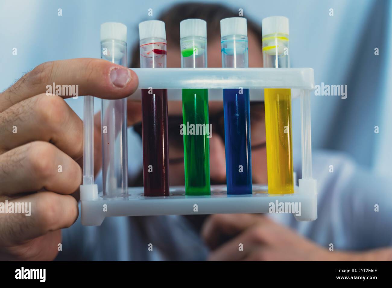 Scientist conducting experiment liquids tools hi-res stock photography ...