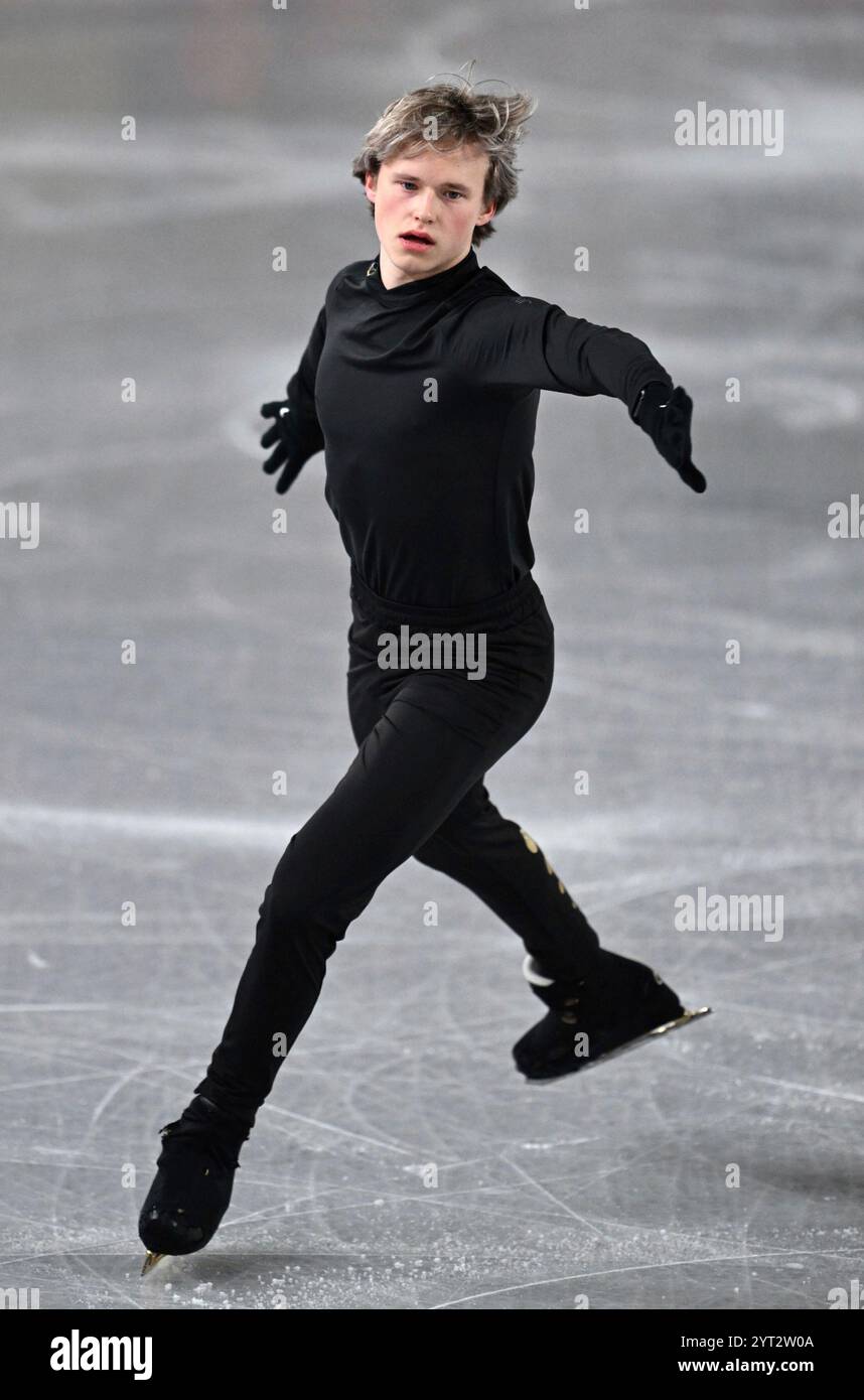 American figure skater Ilia Malinin practices prior to the ISU Grand