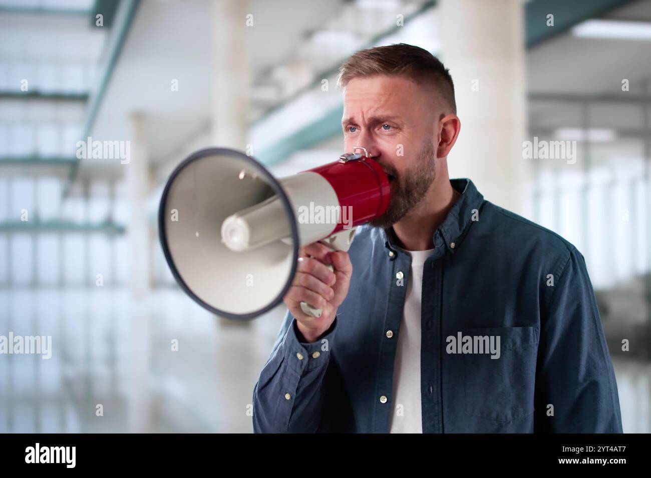 Man Making Megaphone Announcement. Warning Concept Speaker Stock Photo