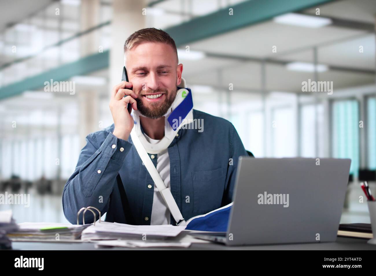 Broken Arm Injured Worker Compensation Coverage. Using Office Laptop Stock Photo