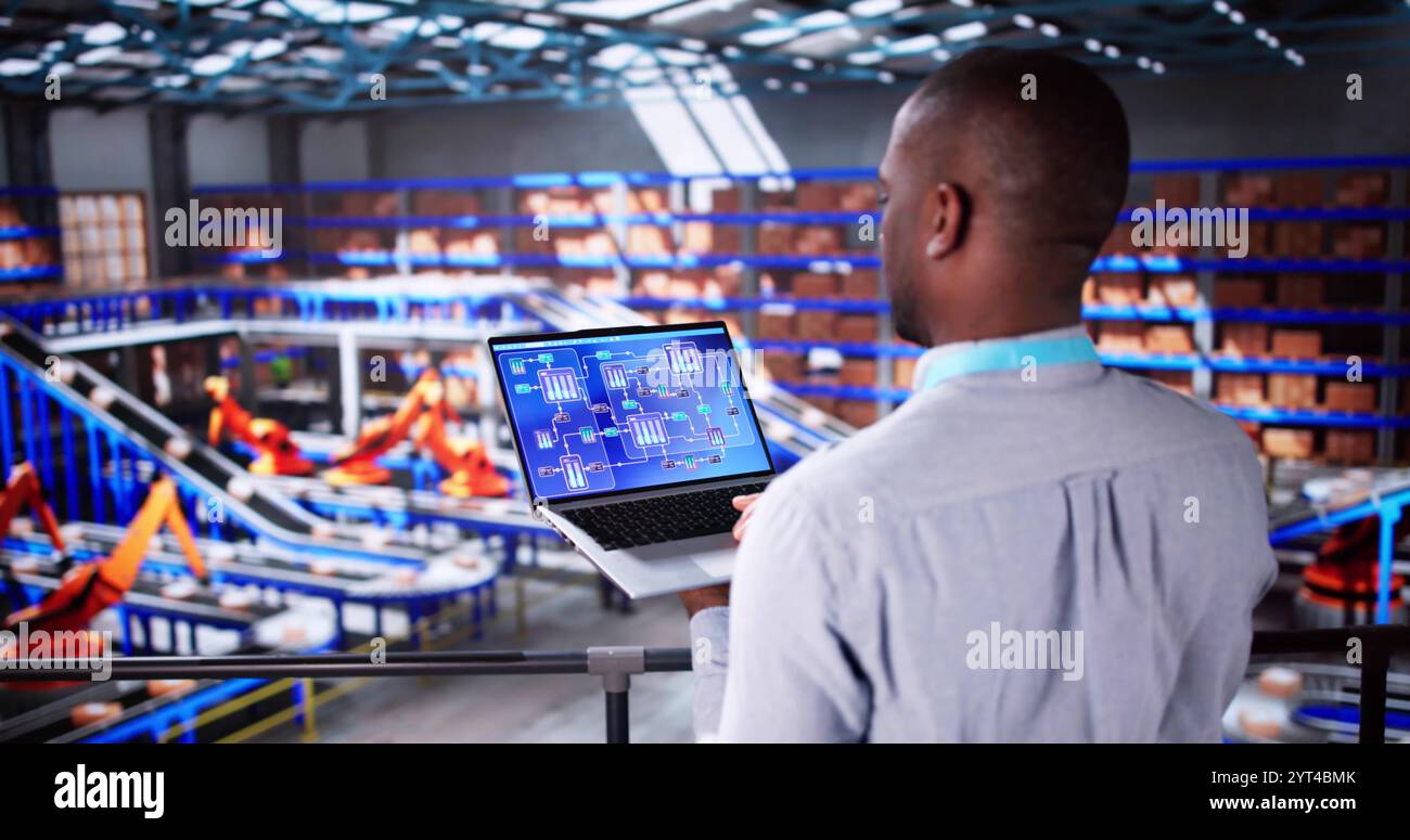 Engineer Worker Using Warehouse Automation Dashboard In Logistic Center Stock Photo