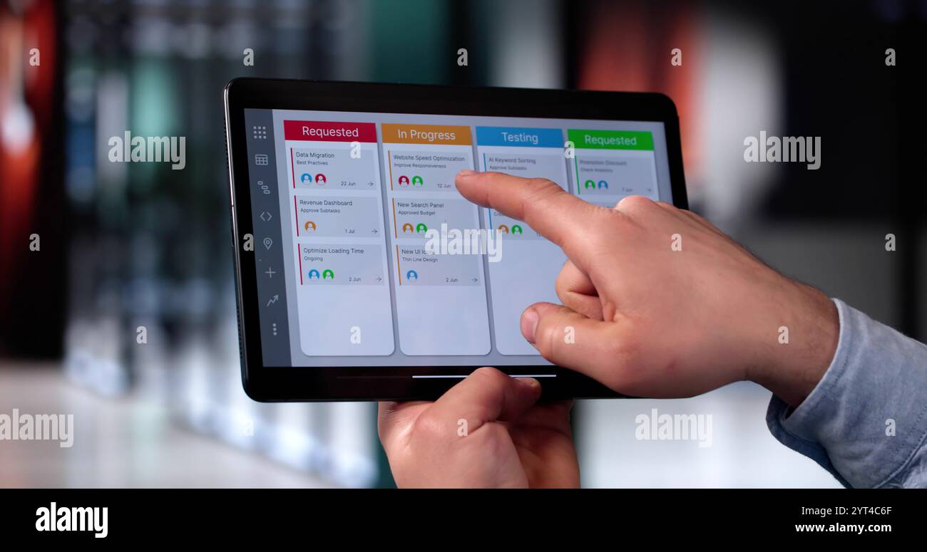 Scrum Project Manager Using Scrum Board Scheduling Software Stock Photo