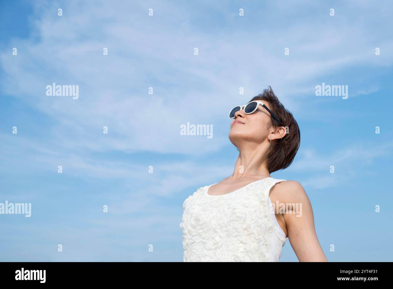 Woman looking up sky hi-res stock photography and images - Alamy