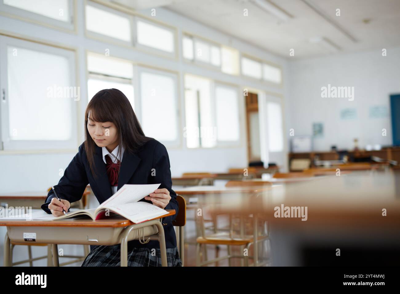 High school girls studying in a classroom Stock Photo - Alamy