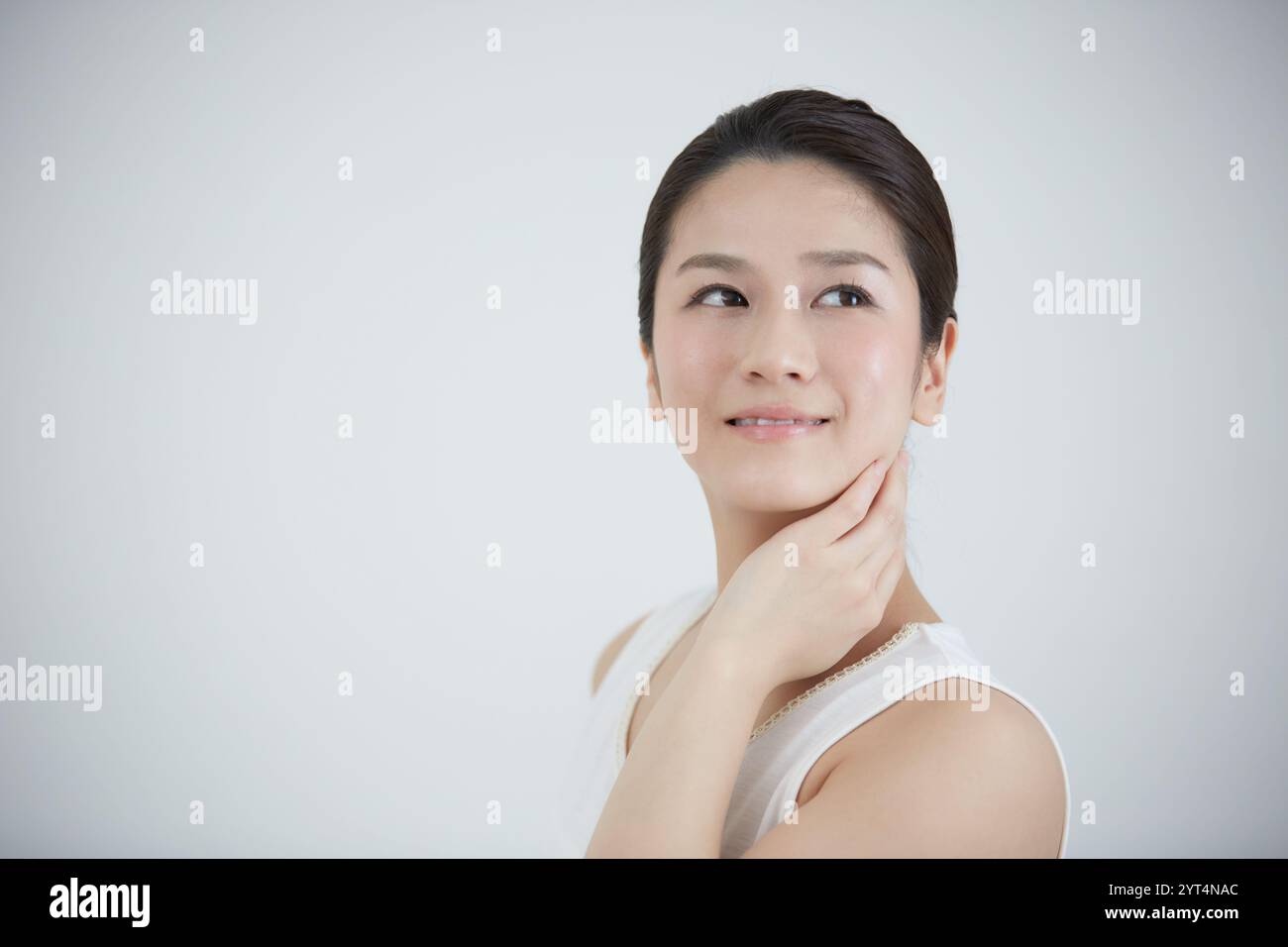 Person in white tank top hi-res stock photography and images - Alamy