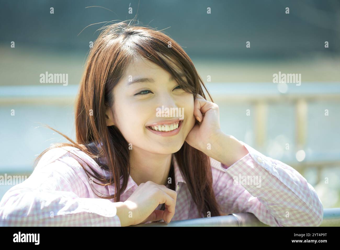 Woman relaxing outdoors Stock Photo - Alamy