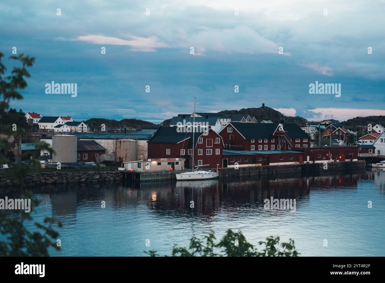 Scenic Nordic harbor in HenningsvÃ¦r, Lofoten, at dusk Stock Photo