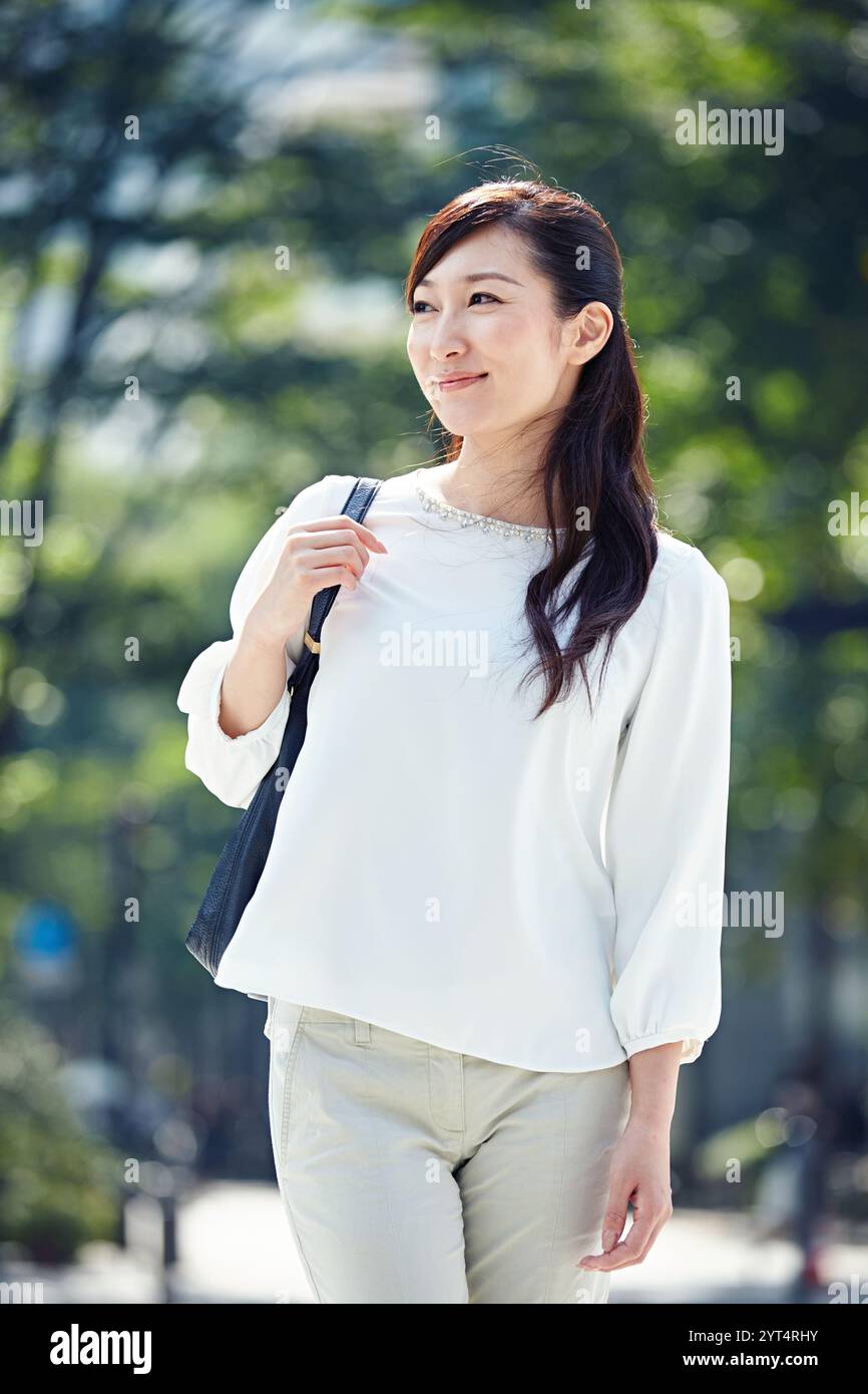 Business woman walking outdoors hi-res stock photography and images - Alamy