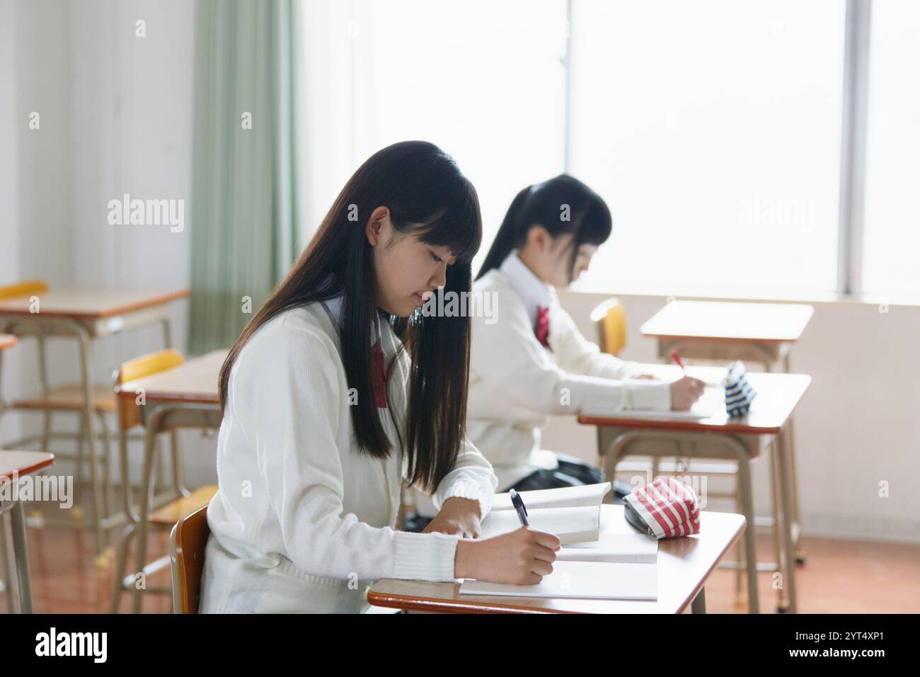 High school girls studying in a classroom Stock Photo - Alamy