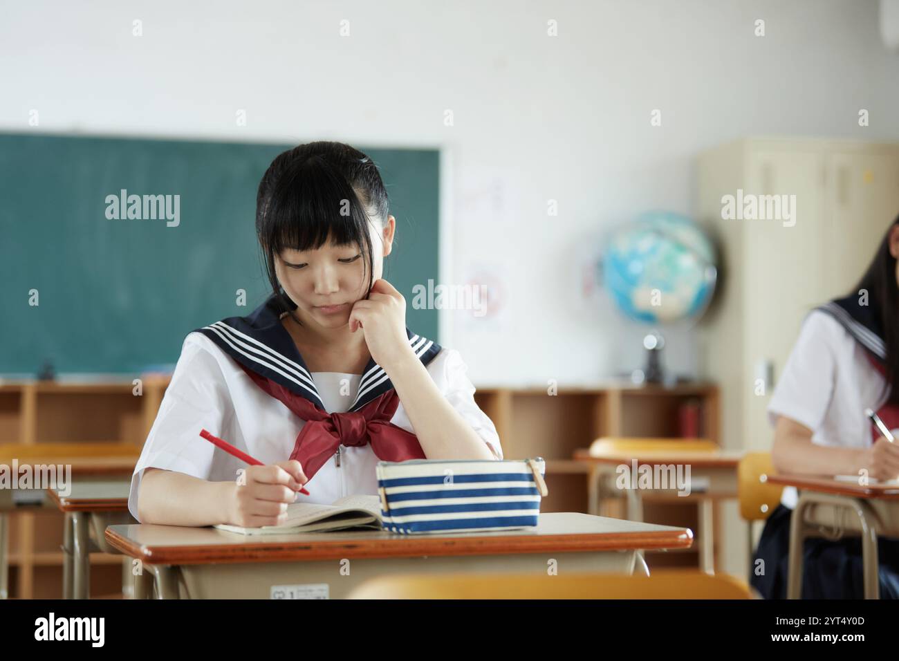 High school girls studying in a classroom Stock Photo - Alamy