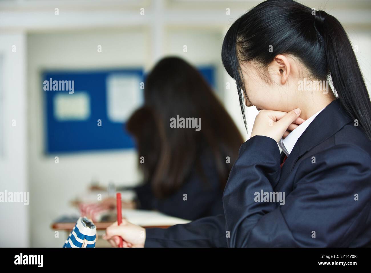 High school girls studying in a classroom Stock Photo - Alamy