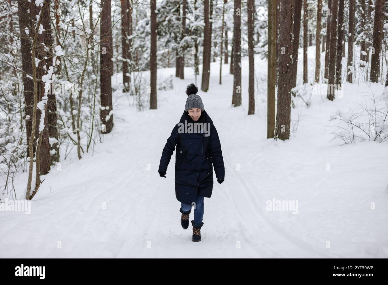 Woman snow pine tree hi-res stock photography and images - Alamy