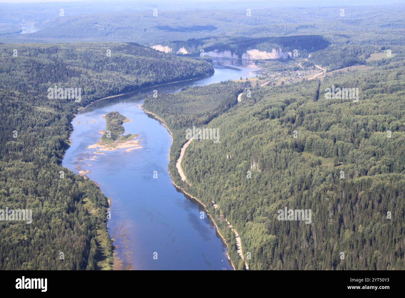 A river flows through a rural forested area Stock Photo - Alamy