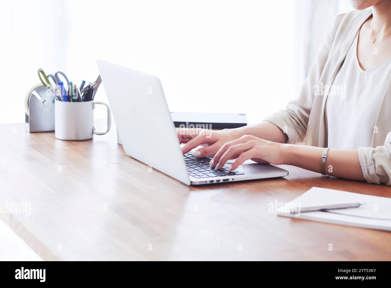 Computer and woman's hand Stock Photo - Alamy