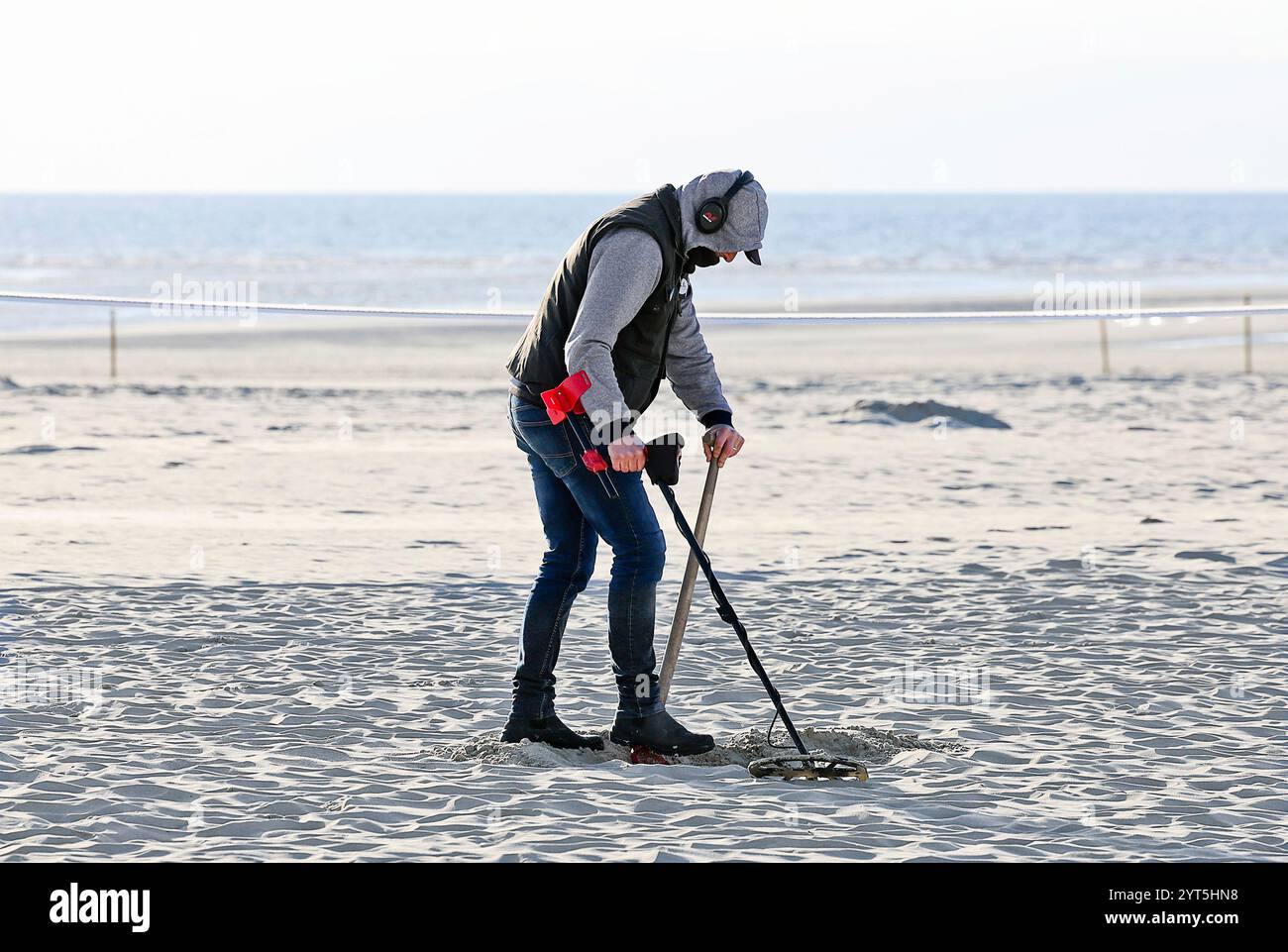 Man with a metal detector on the beach of Berck-sur-Mer (northern ...