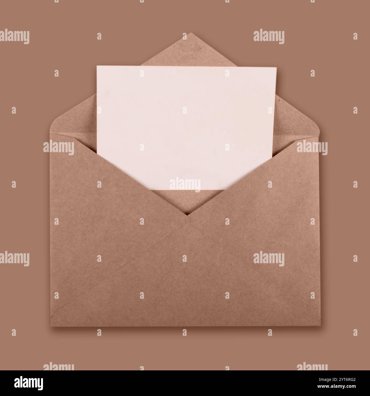 Recicled brown craft envelope with white blank card inside Stock Photo