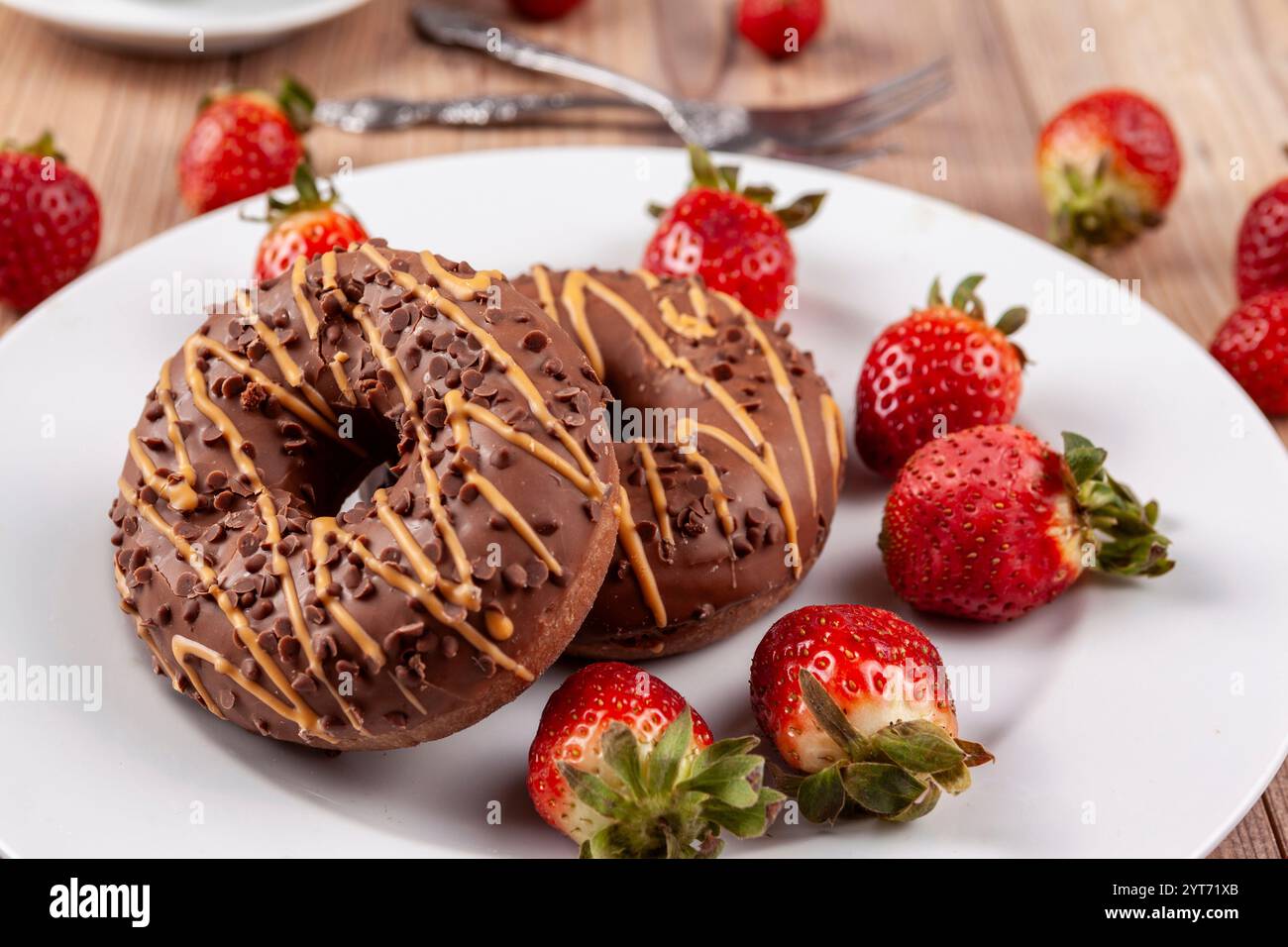 Strawberry chocolate donut covered hi-res stock photography and images ...