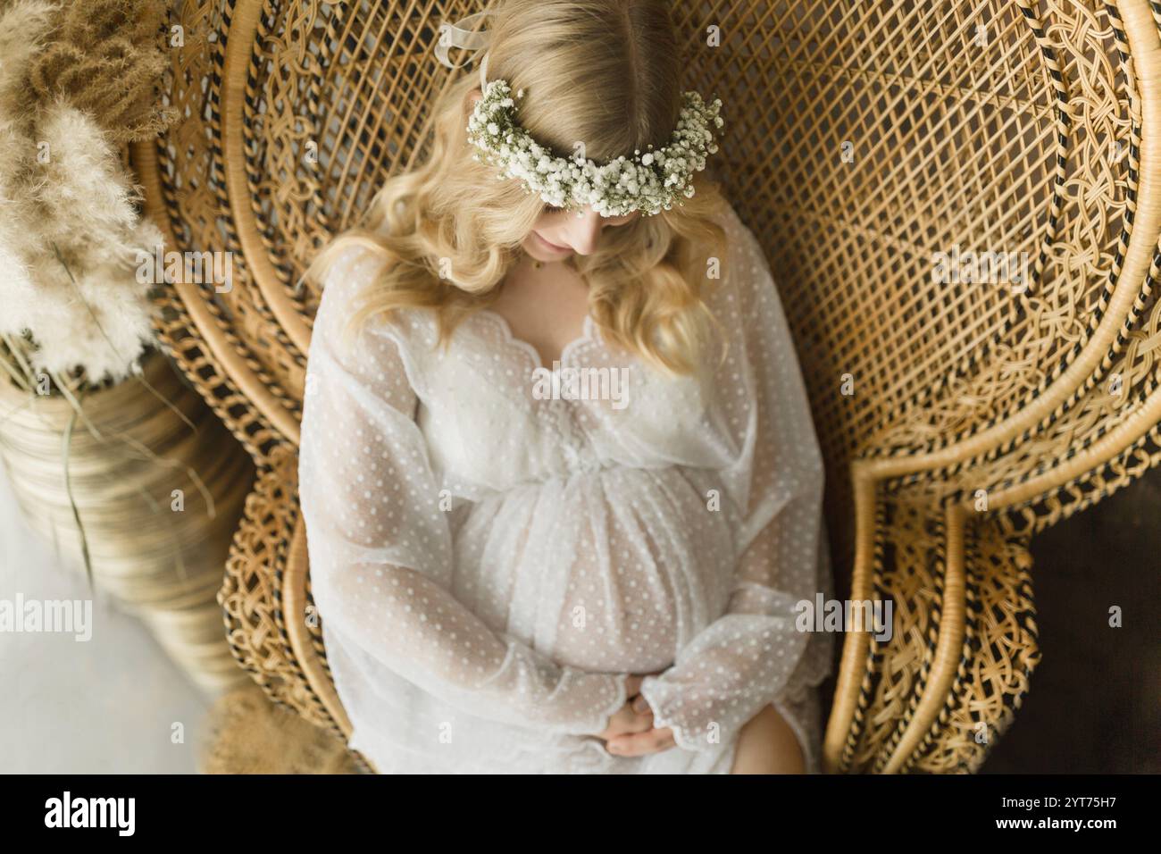 Woman sitting arm chair hi-res stock photography and images - Alamy