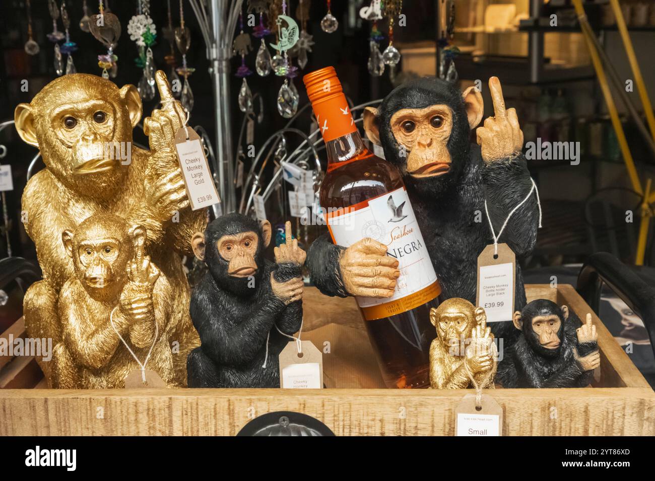 England, Kent, Rochester, Shop Window display of Cheeky Monkey Figures Stock Photo