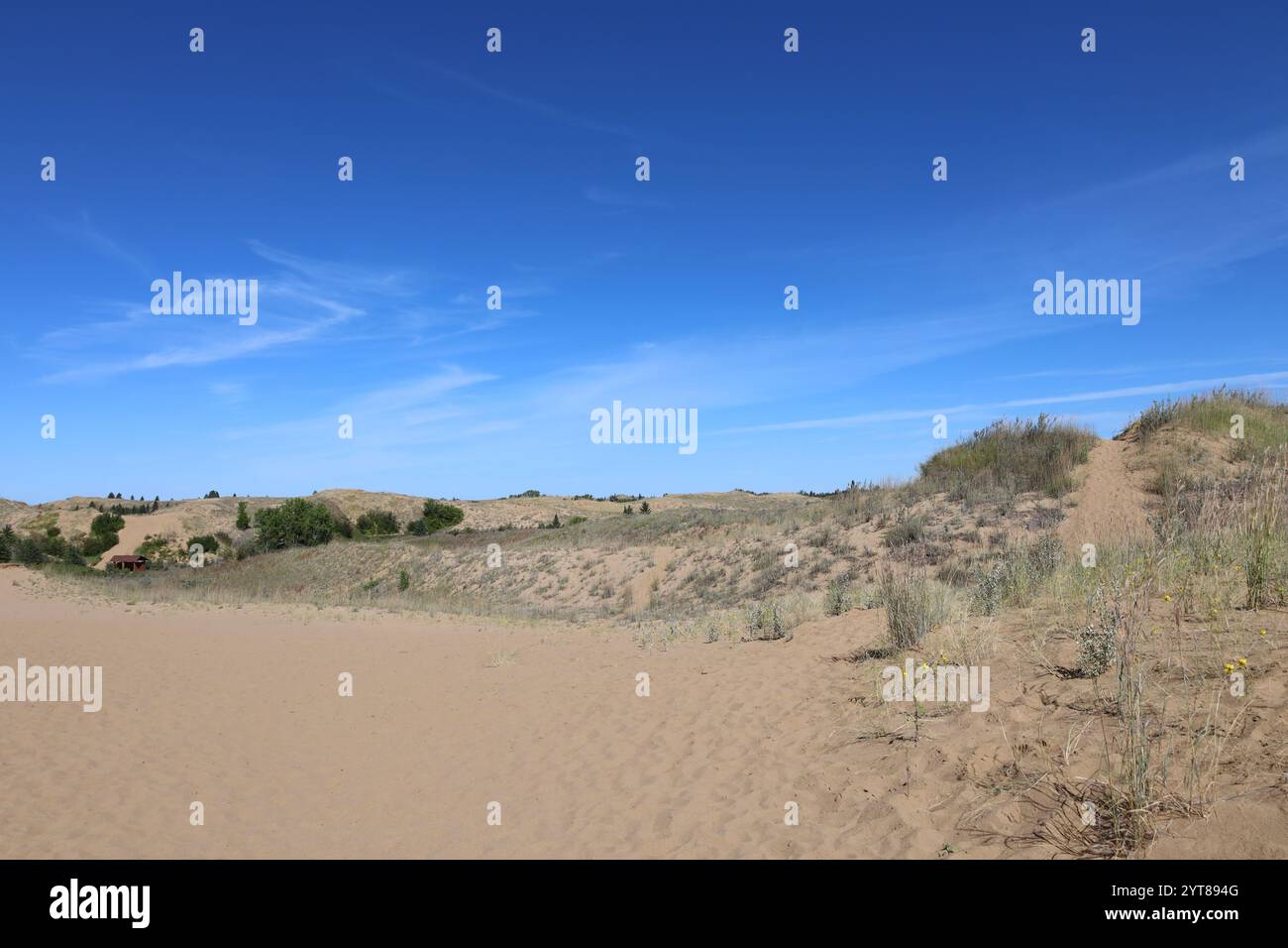 landscape rugged desert dunes under deep blue skies Stock Photo