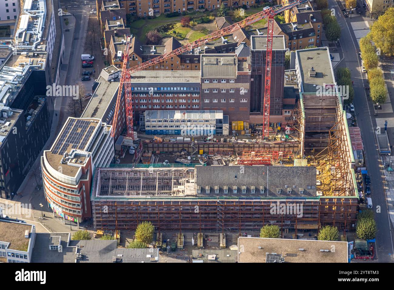 Aerial view, red brick building inner courtyard with construction site ...