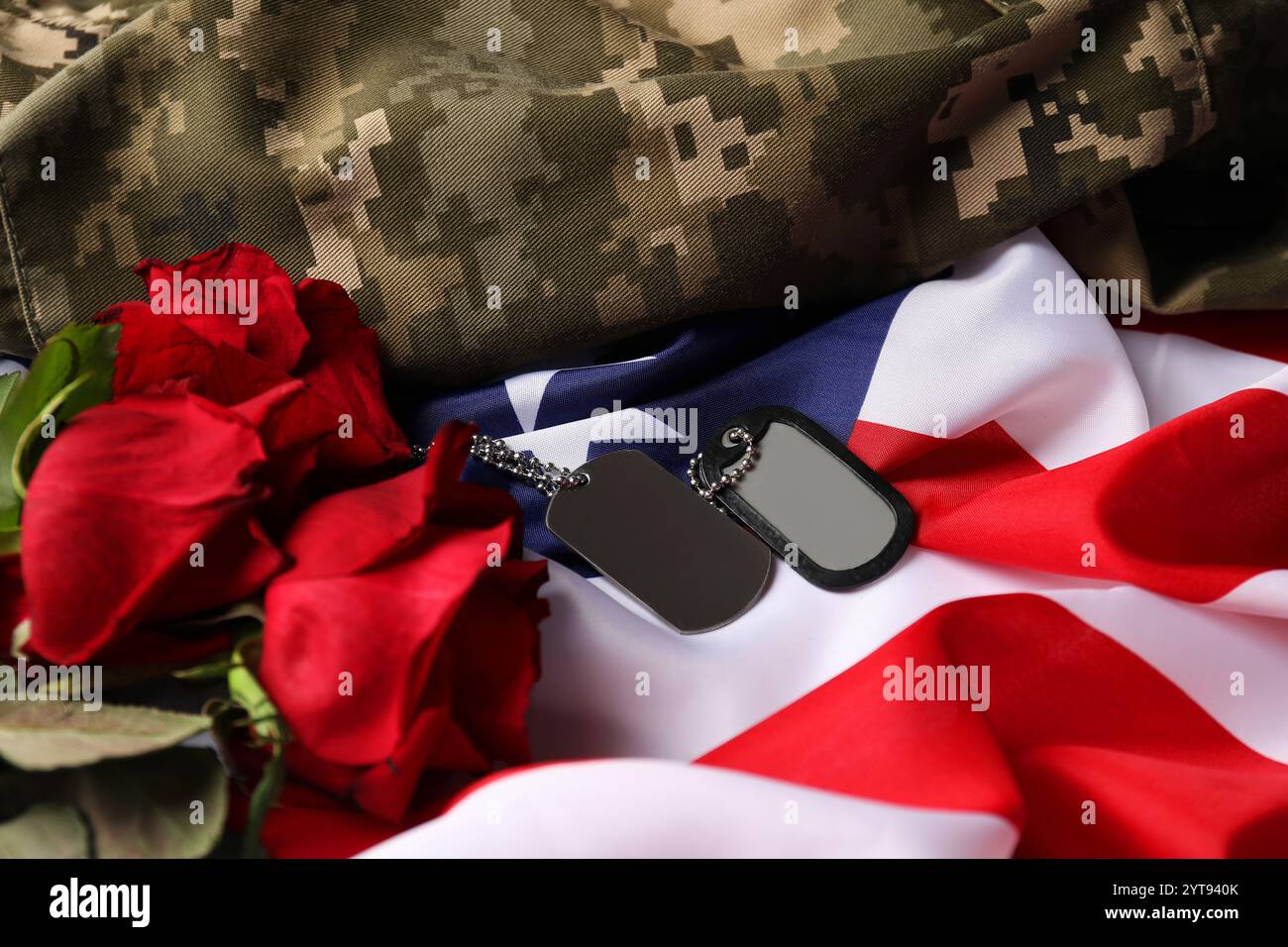 Veterans day. American flag, roses, army tokens and military uniform ...