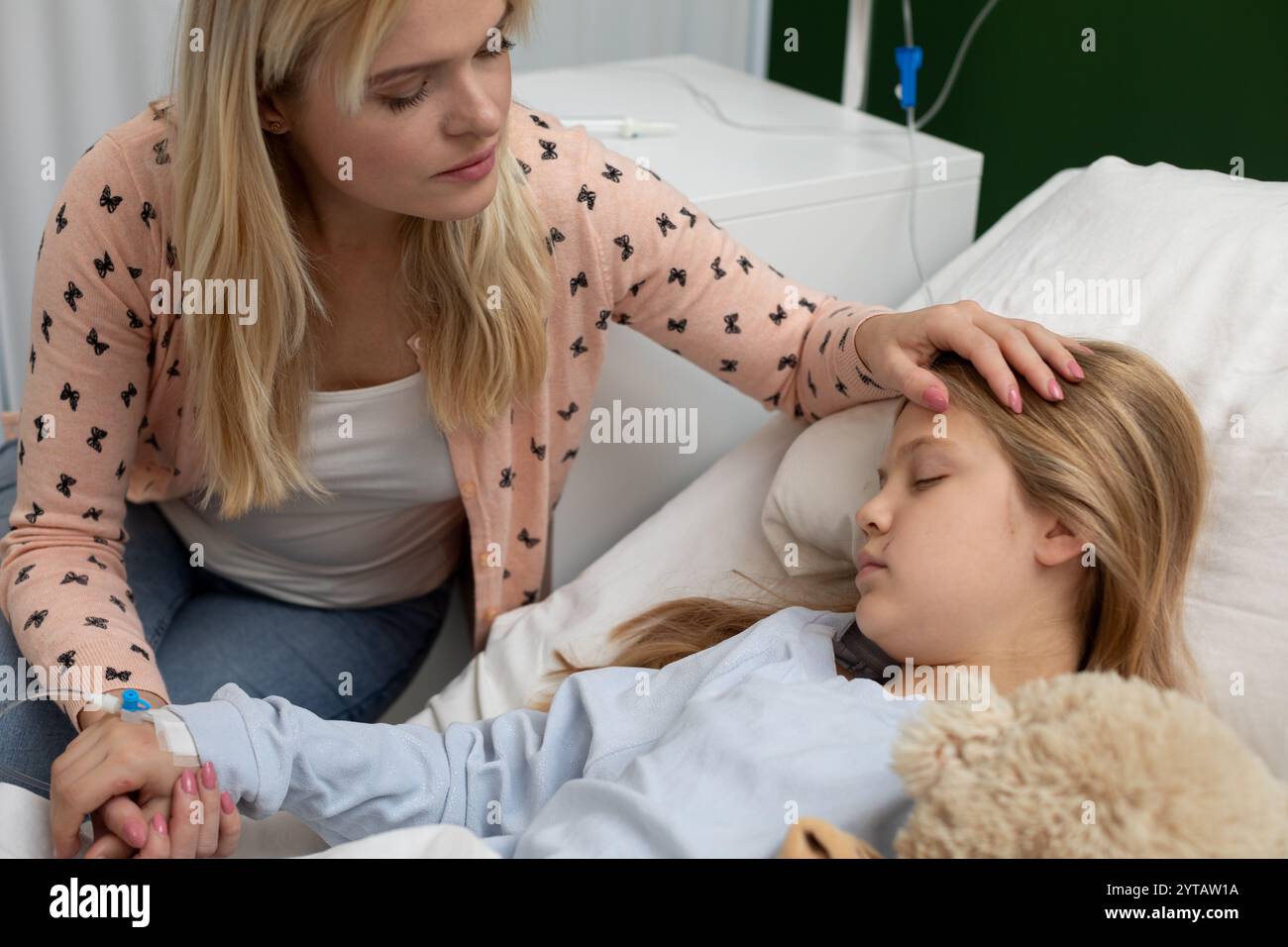 Tender Care A Loving Mother Comforts Her Sick Daughter in the Hospital ...