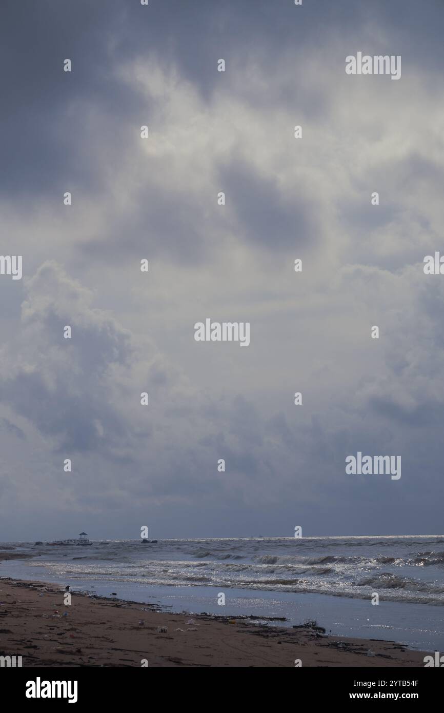 Dark clouds and unfriendly weather indicate that there will be a storm on the coast of Balikpapan Stock Photo
