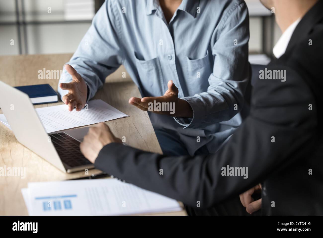 Cropped view two traders analysts discussing market trends Stock Photo