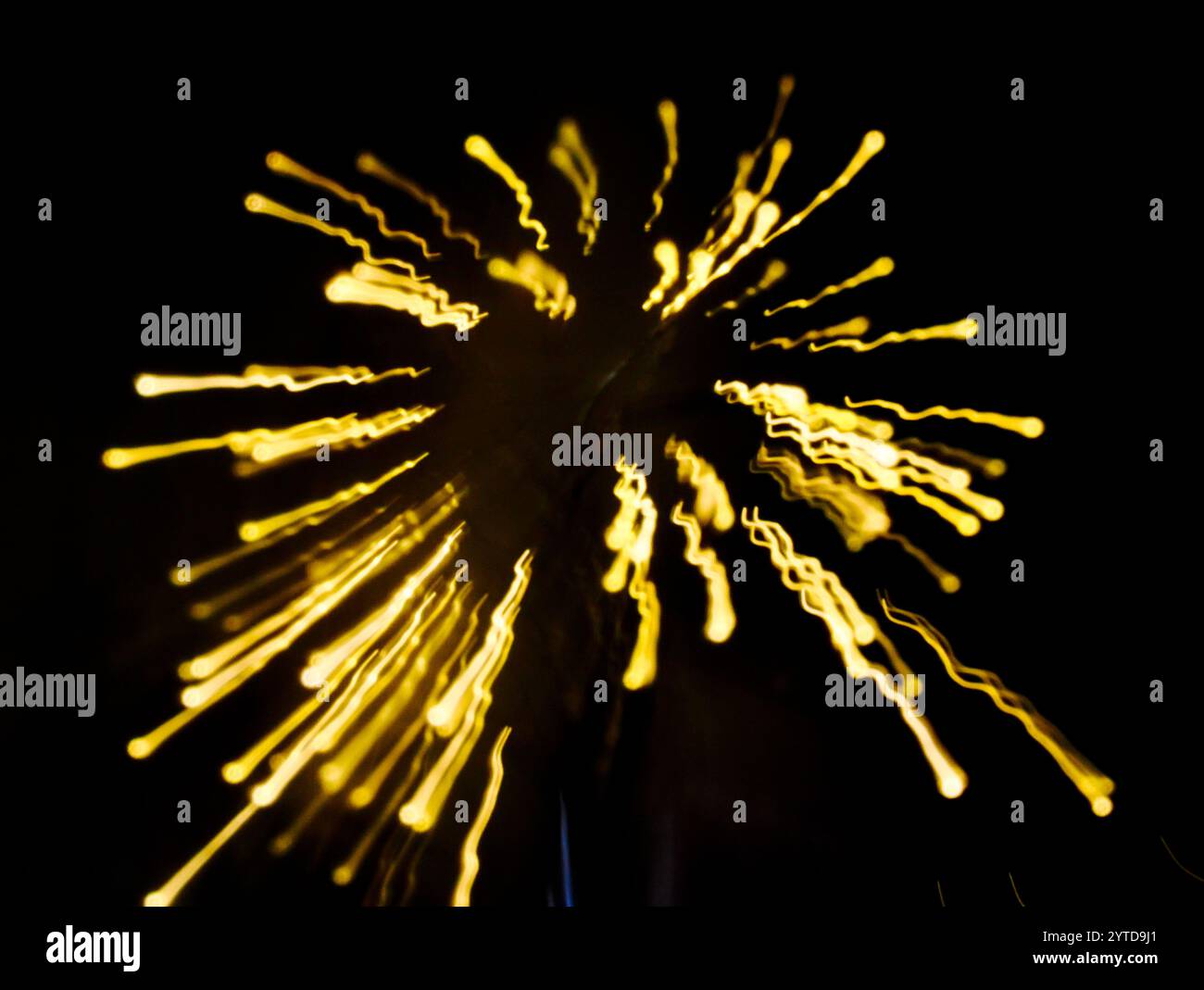 Abstract golden light streaks against a dark background Stock Photo - Alamy