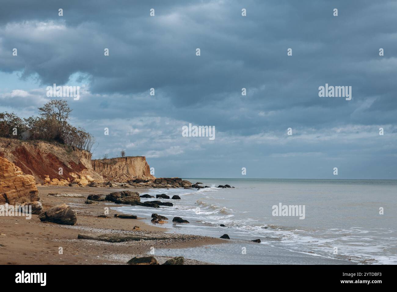 Early morning sunrise over the sea . Some clouds. Stock Photo