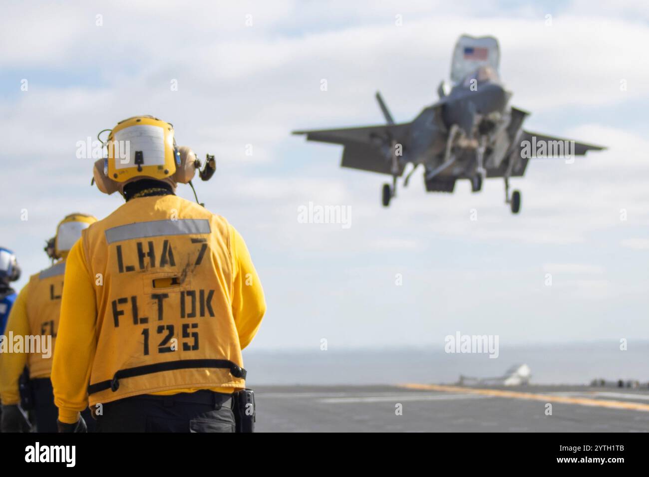 241204-N-IL330-4341  An F-35B Lightning II attached to Marine Fighter Attack Squadron (VMFA) 211, 3rd Marine Aircraft Wing, lands on the flight deck o Stock Photo