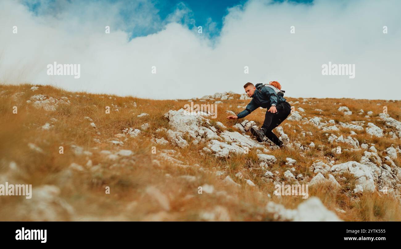 Male hiker walk up rocky hi-res stock photography and images - Alamy