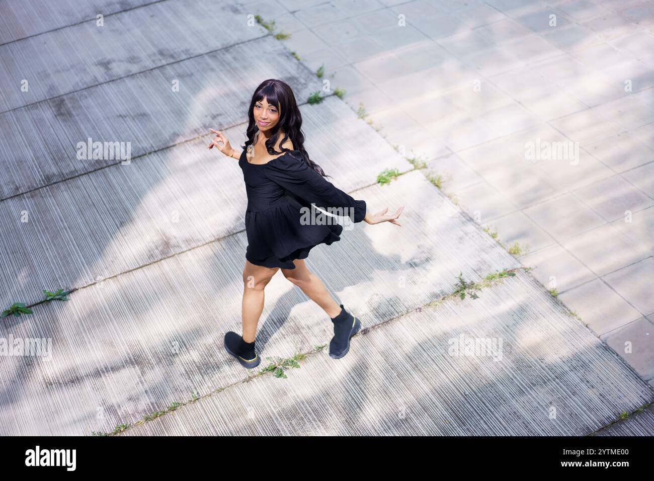 Long cool woman in a black dress hi-res stock photography and images - Alamy