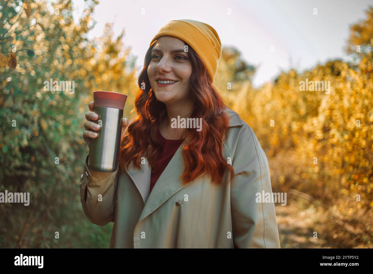Profile of a relaxed 30s woman drinking coffee and smelling aroma in a ...