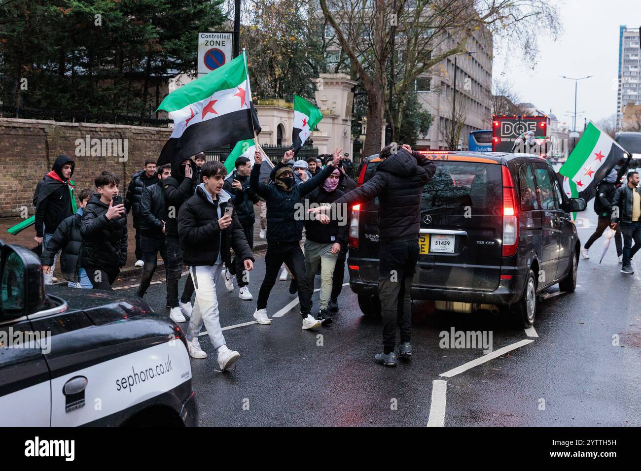 London, UK. 7th December, 2024. Jubilant Syrians attending a protest outside the Russian embassy against the Russian bombing of Idlib celebrate the latest rapid advances in Syria made by opposition groups. According to reports today, Syrian opposition fighters are taking the city of Homs and advancing on Damascus. The protest was organised by Syria Solidarity Campaign. Credit: Mark Kerrison/Alamy Live News Stock Photo